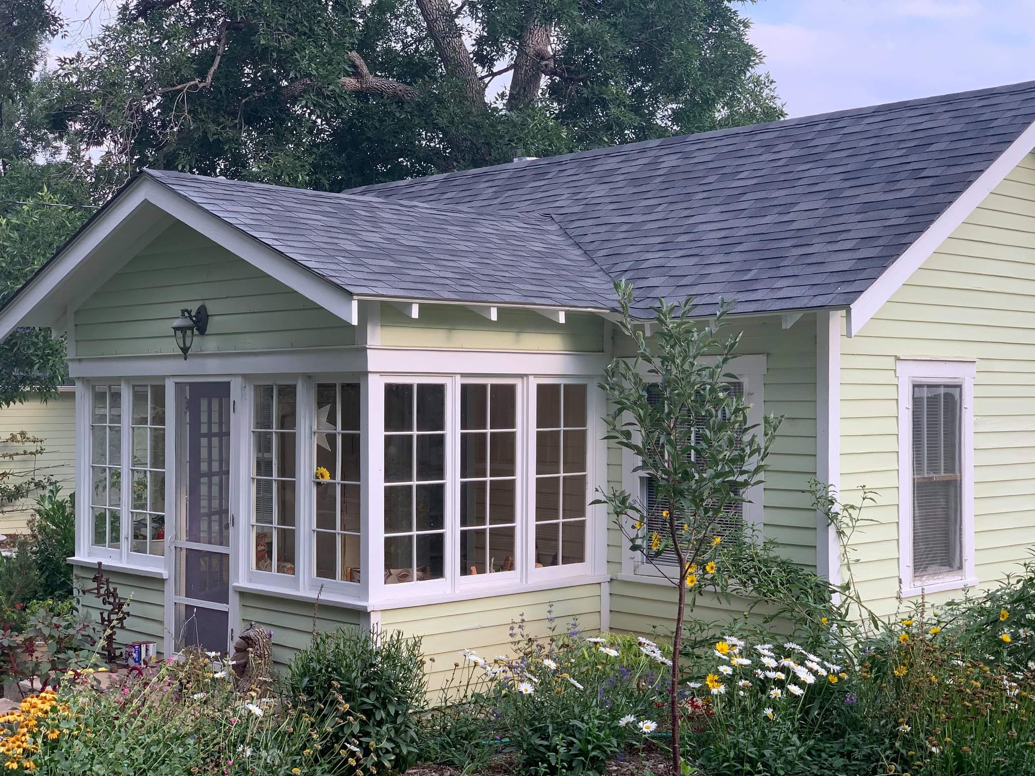 Small residential house with new roof from an insurance claim